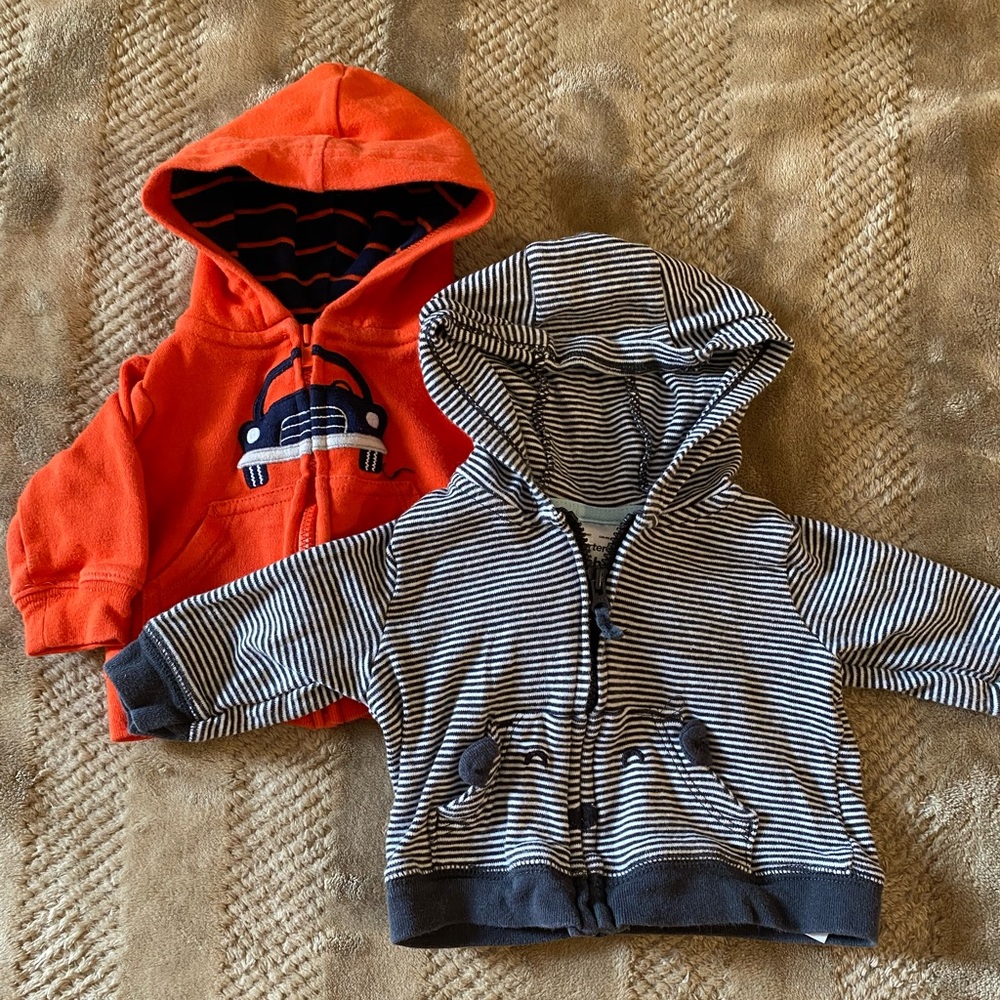 Two newborn zip up jackets
